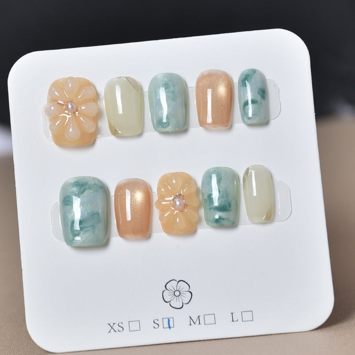 Elegant Nail Art Extensions with Pearl Accents Stornfield