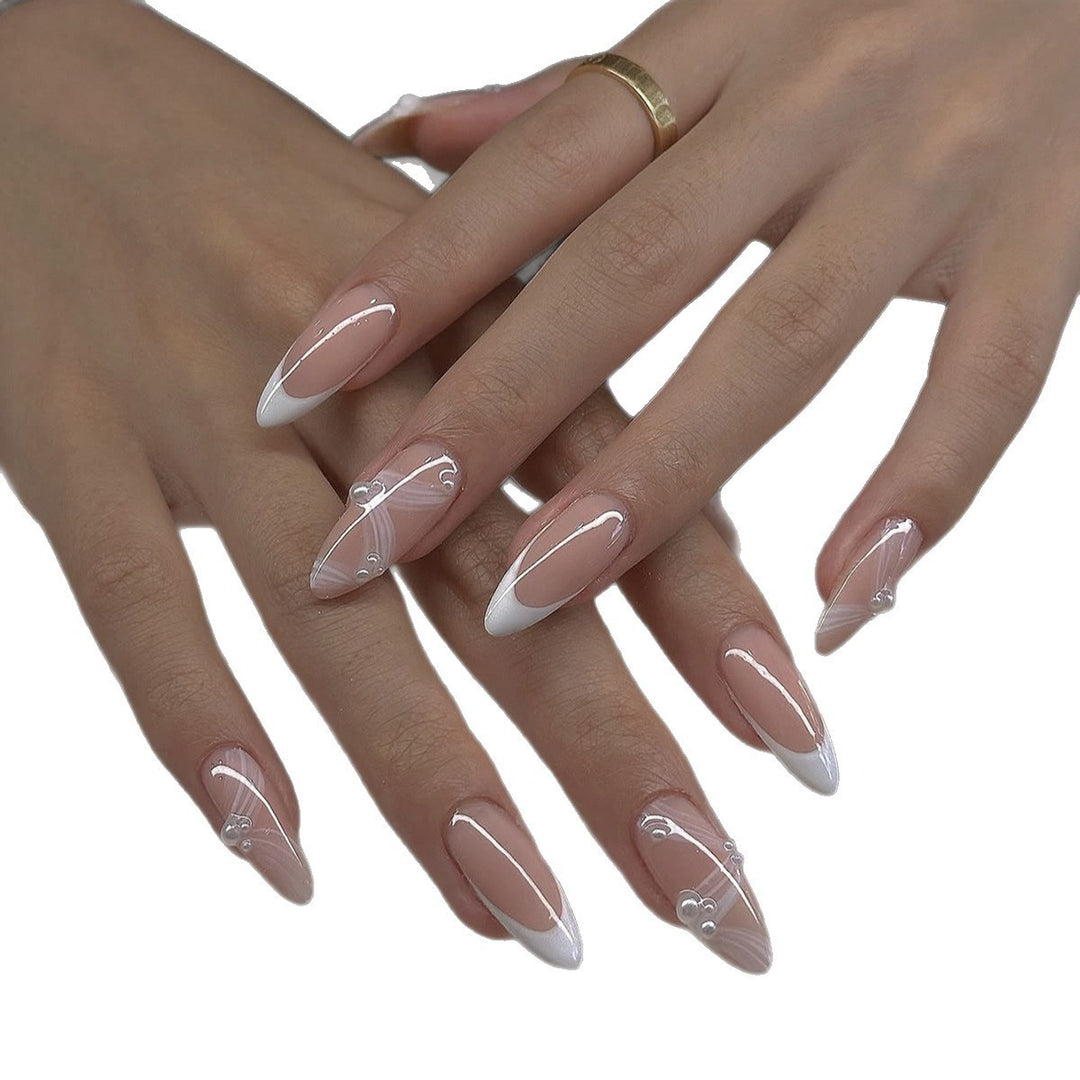 Creative acrylic nail set with elegant tips and glitter decorations Stornfield