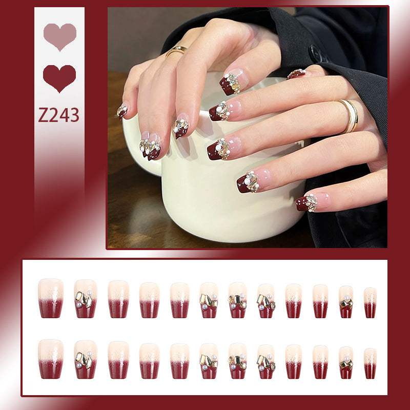 Acrylic nail set with elegant glitter and flower accents Stornfield