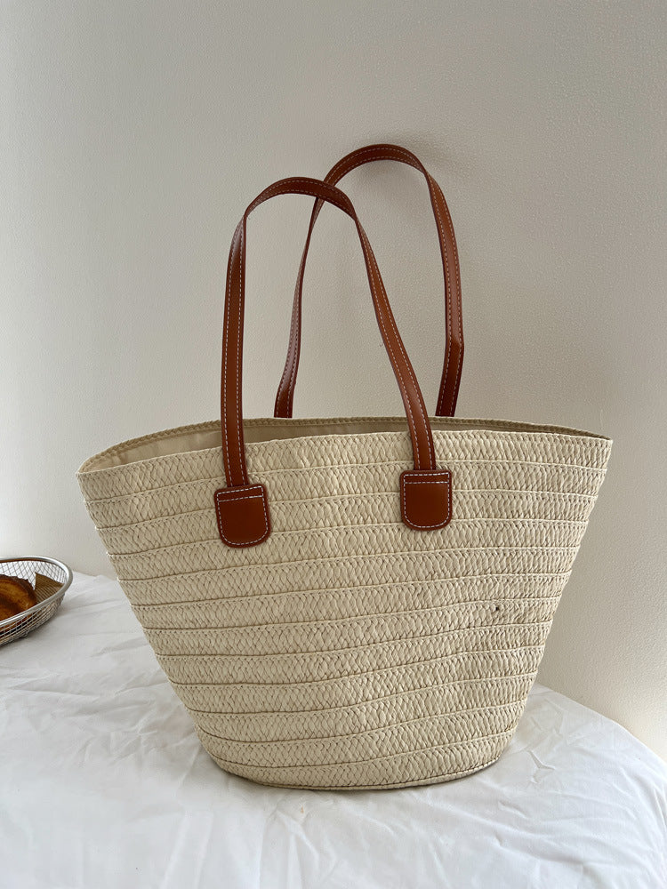 Handcrafted straw bag with elegant leather handles Stornfield