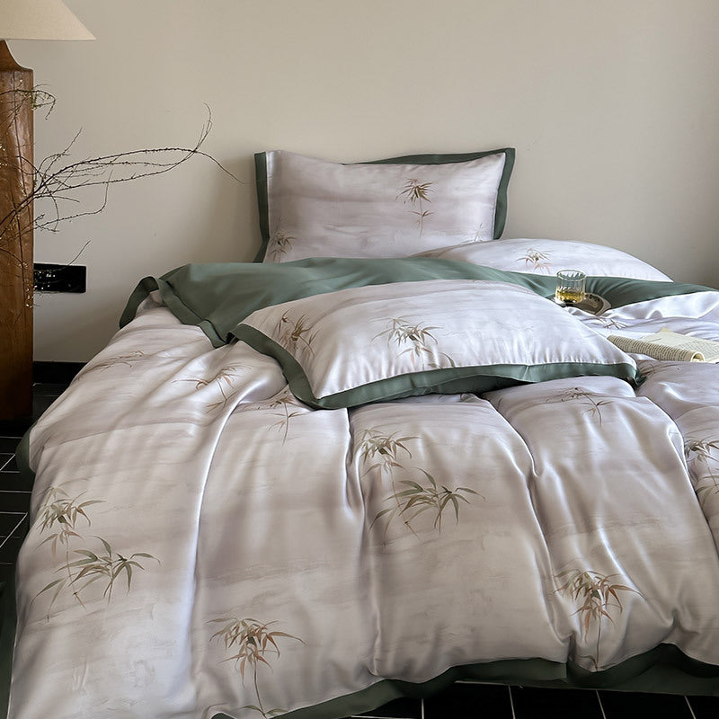 Luxurious satin bedding set with subtle bamboo print and contrasting decorative piping