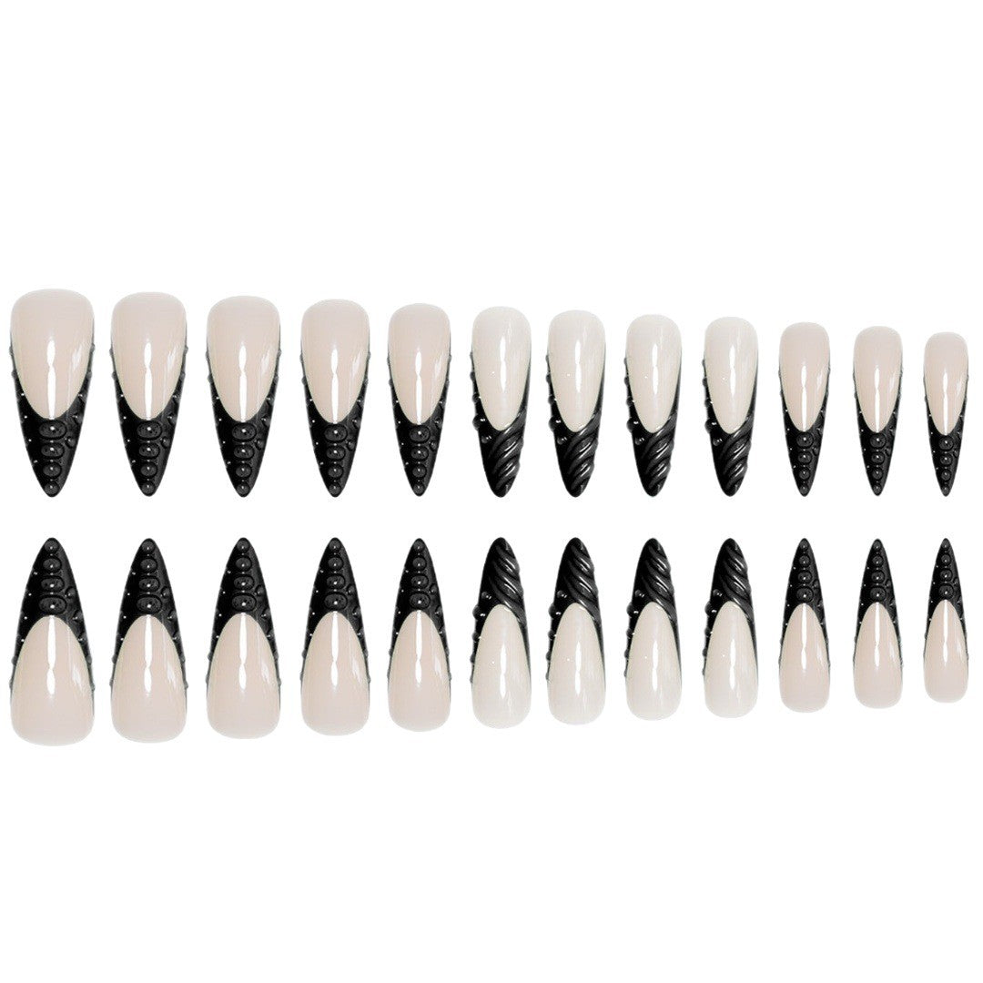 Artistic Stiletto Nail Extensions with Textured Detailing Stornfield