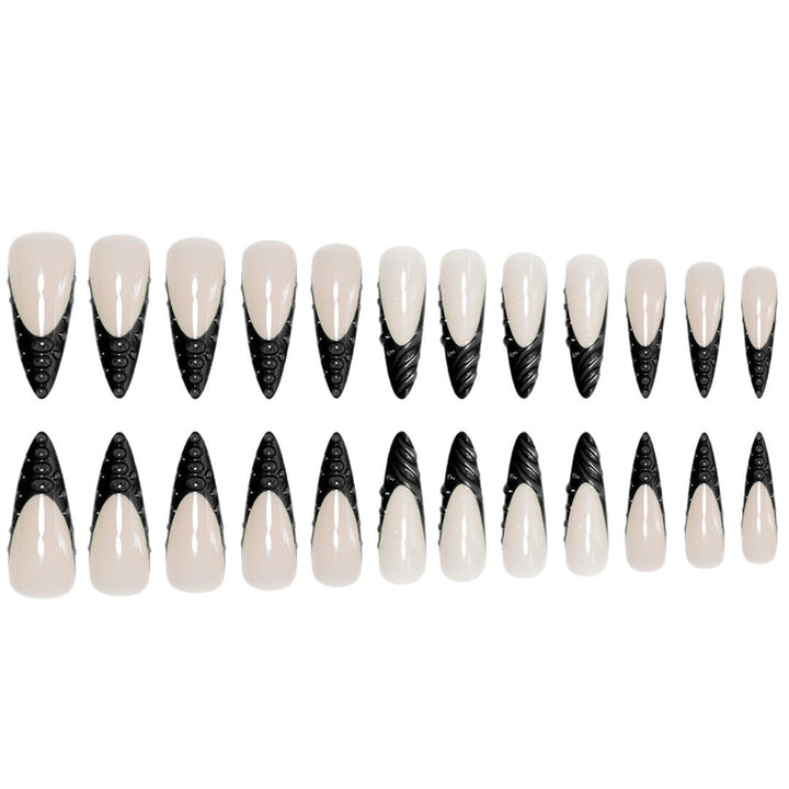 Artistic Stiletto Nail Extensions with Textured Detailing Stornfield