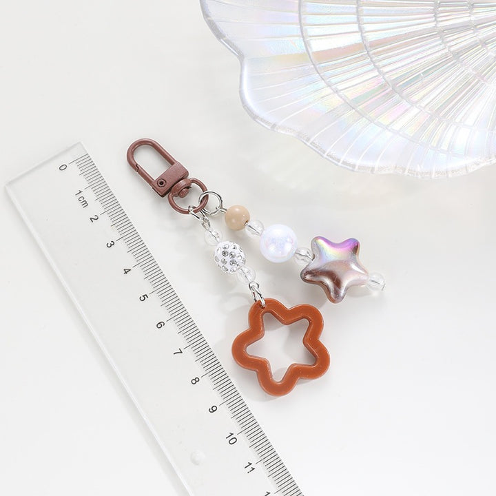 Playful keychain with floral and star motif Stornfield
