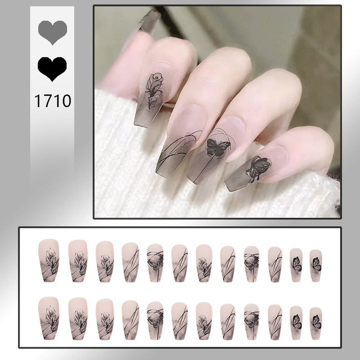 Artificial nail set with elegant flower design and delicate butterfly motifs Stornfield