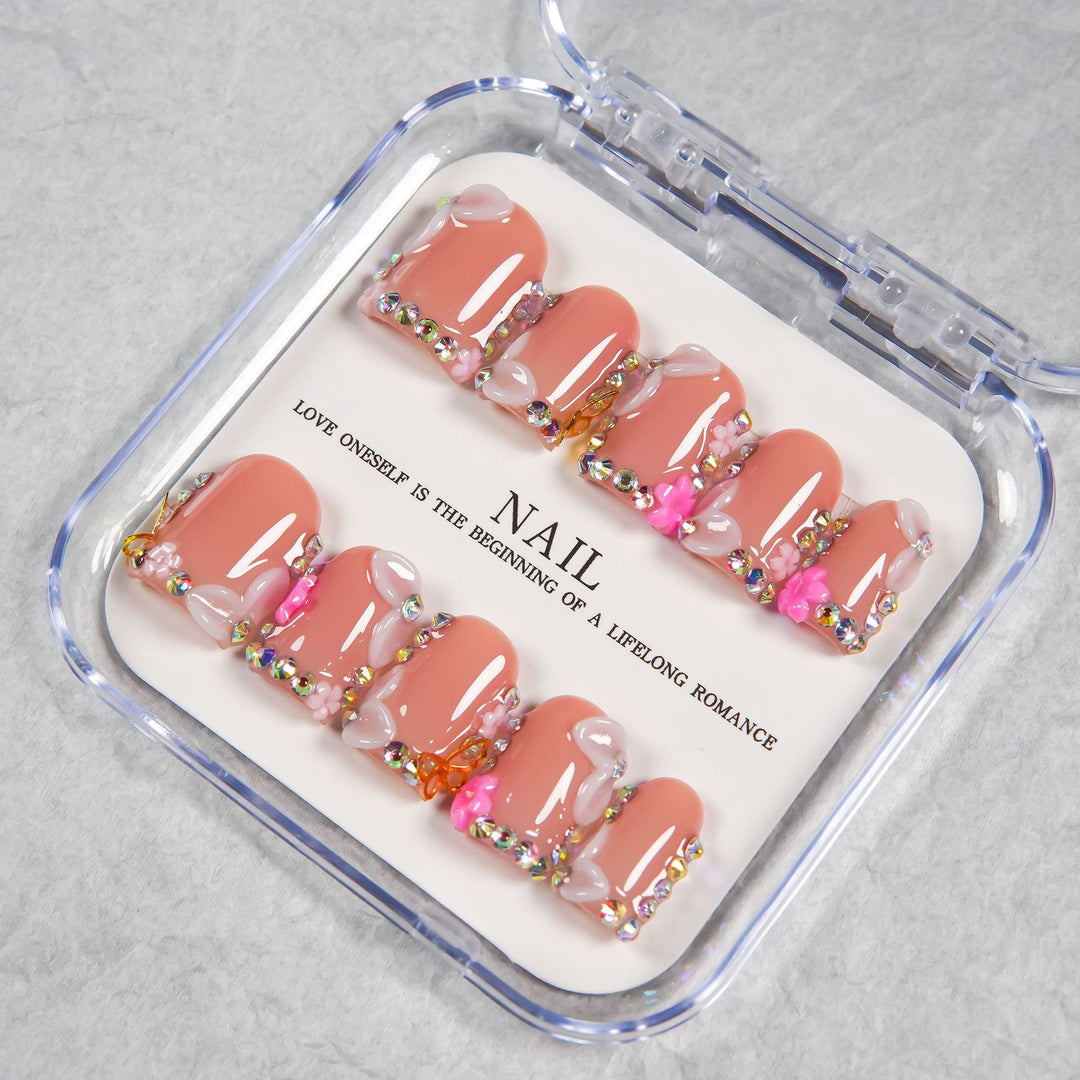 Decorative Press-On Nail Set with Soft Pink Accents and Gem Details