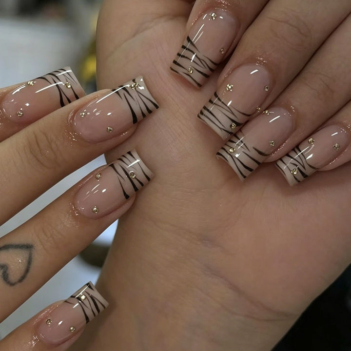 Art nail set with elegant lines and glitter accents Stornfield