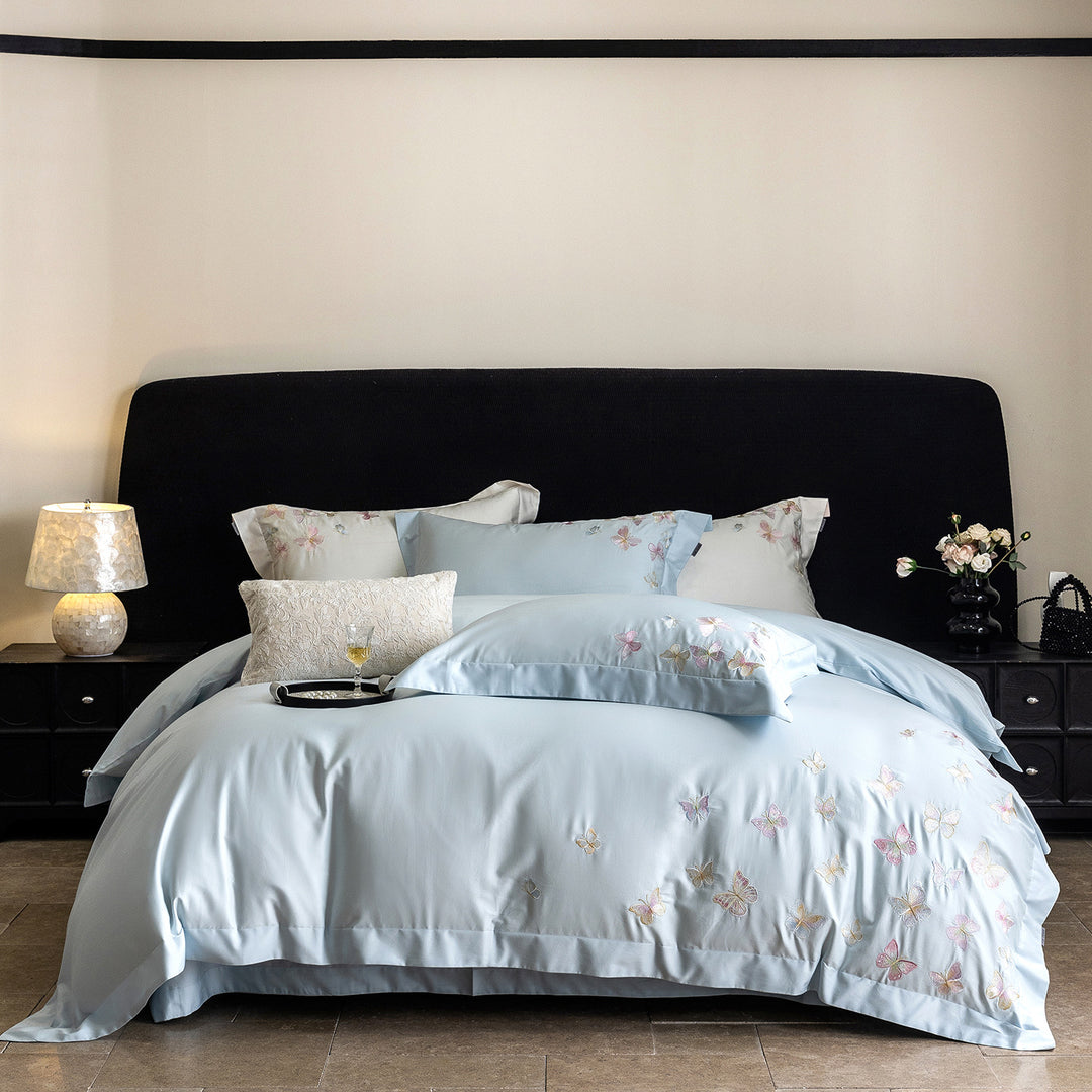 Premium bedding set made of extra soft cotton satin with delicate butterfly embroidery and concealed hotel closure
