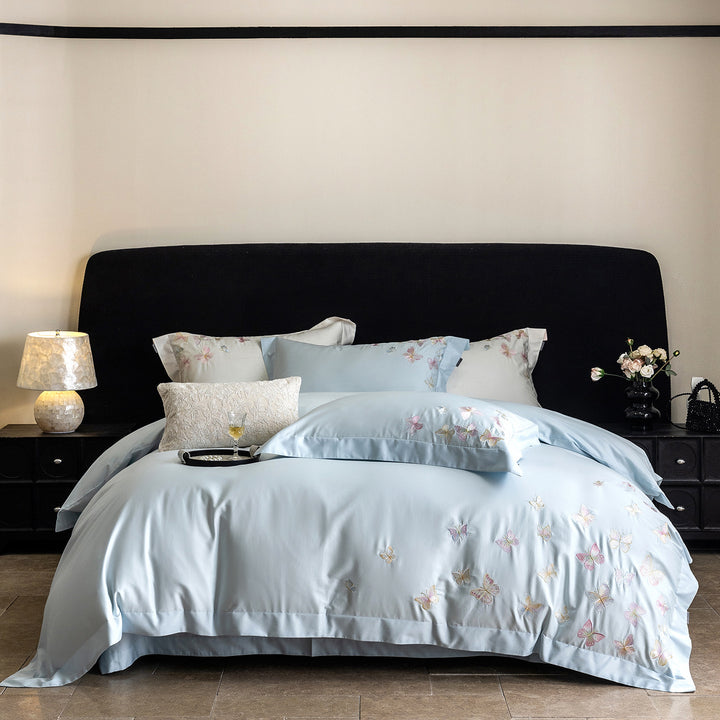 Premium bedding set made of extra soft cotton satin with delicate butterfly embroidery and concealed hotel closure