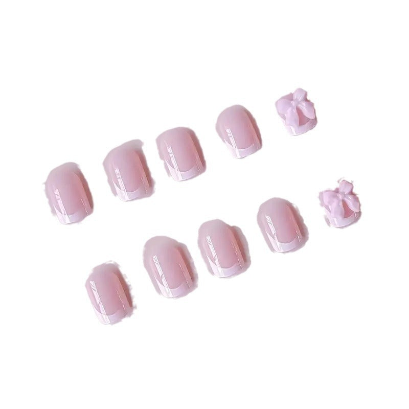 Elegant French Tip Press-On Nails with Bow Detail Stornfield