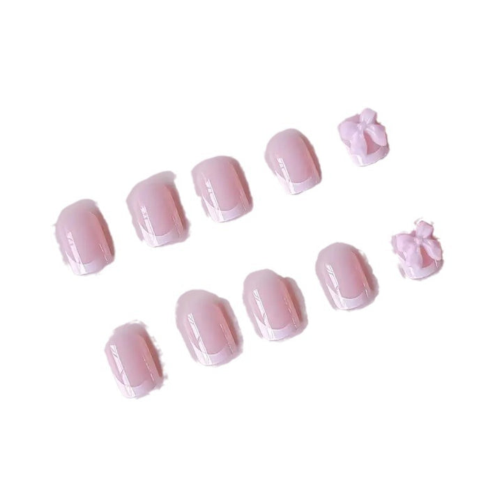 Elegant French Tip Press-On Nails with Bow Detail Stornfield