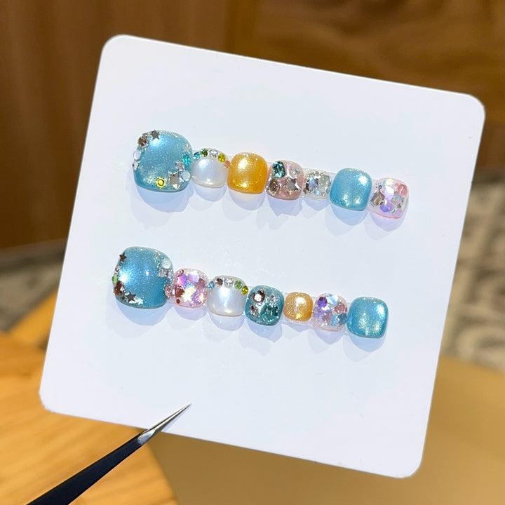 Artificial nails with sparkling accents and glittering design Stornfield
