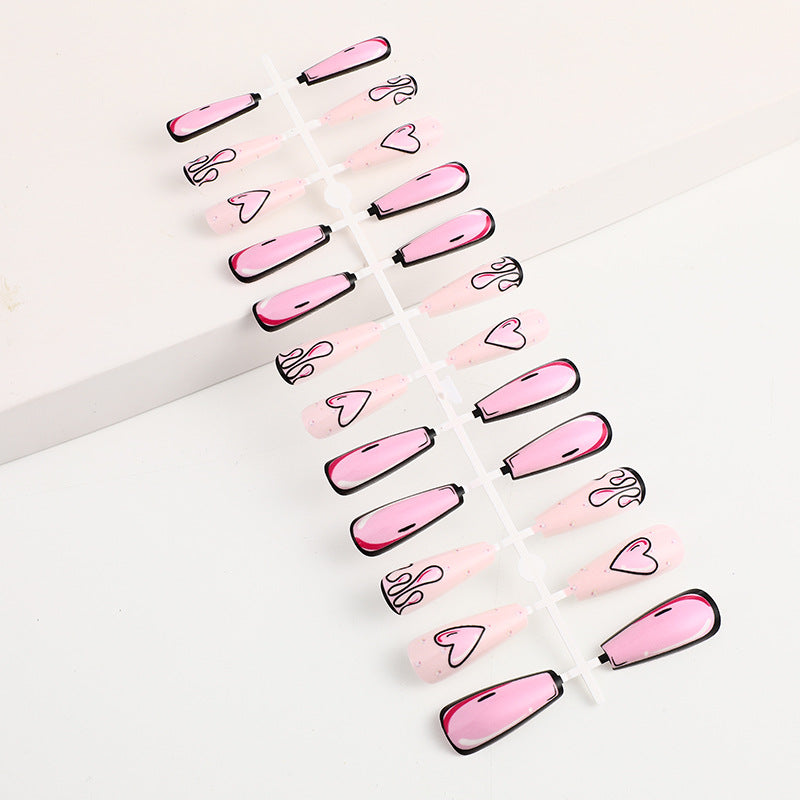 Eye-catching artificial nails with soulful heart design and glamorous accents Stornfield