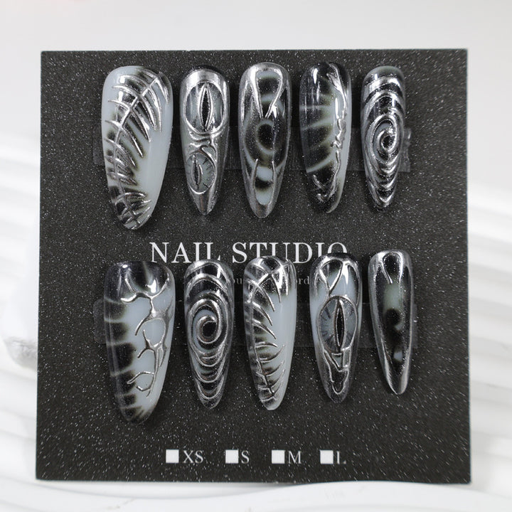 Artificial nail set with modern spiral pattern and shiny accents Stornfield