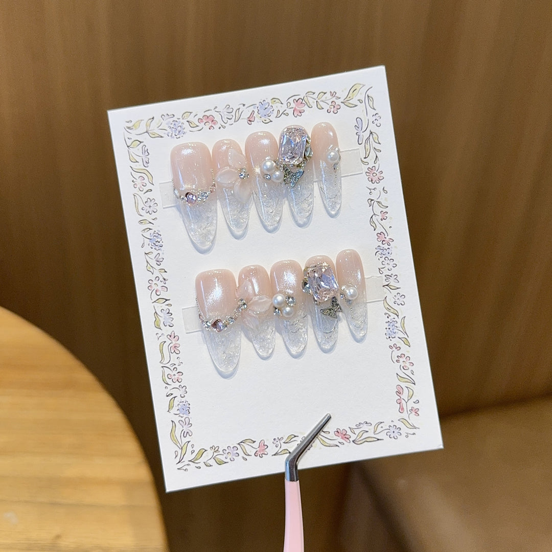 Artificial nails with delicate glitter and pearl decoration Stornfield