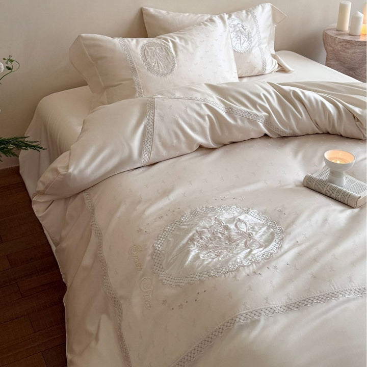 Luxurious cotton satin bedding set with embroidered medallion appliqués and lace trim