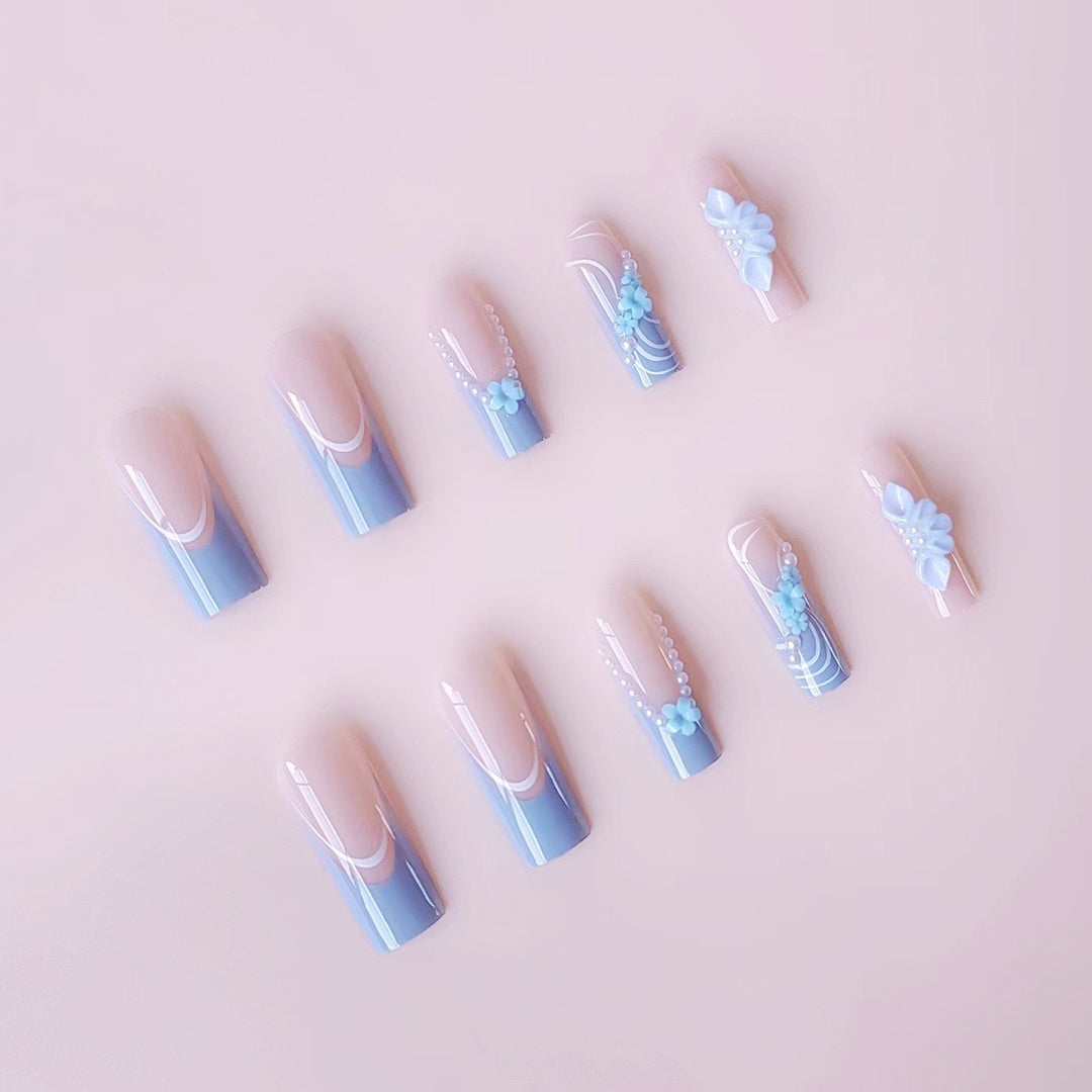 Art nail set with delicate floral accents and elegant embellishments Stornfield