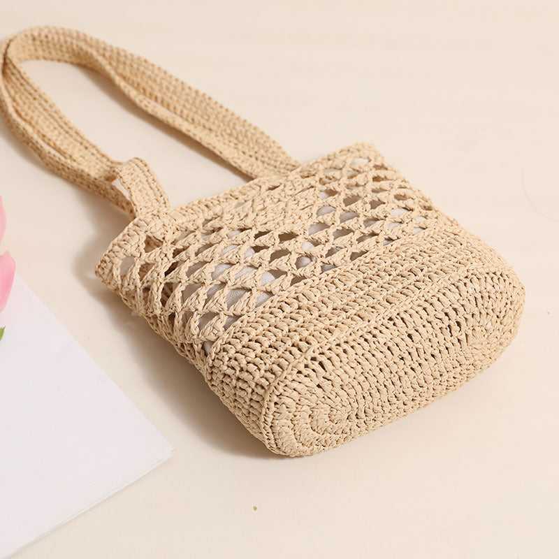 Handcrafted net straw bag with elegant straps Stornfield