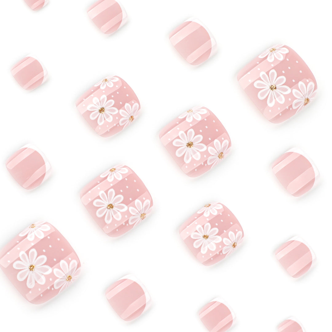Artistic toenail art with elegant daisy motifs Stornfield