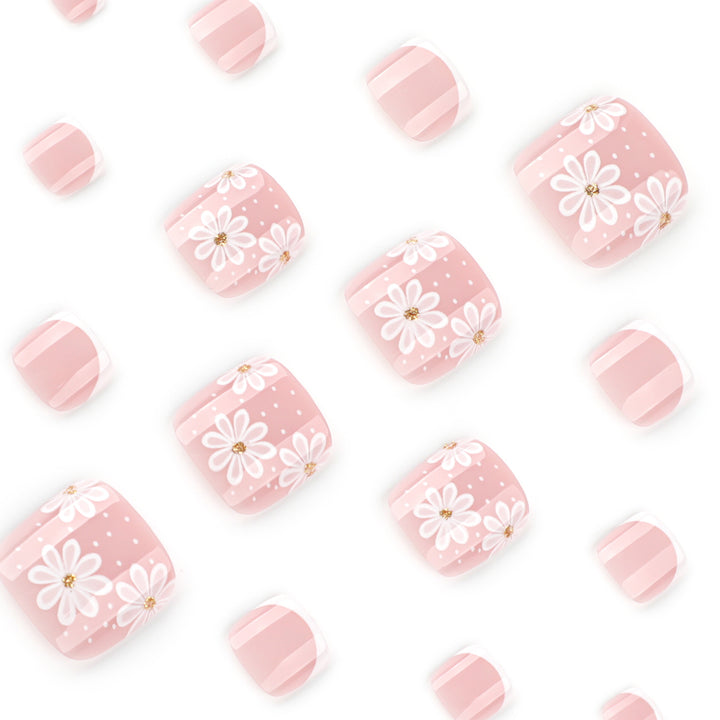 Artistic toenail art with elegant daisy motifs Stornfield