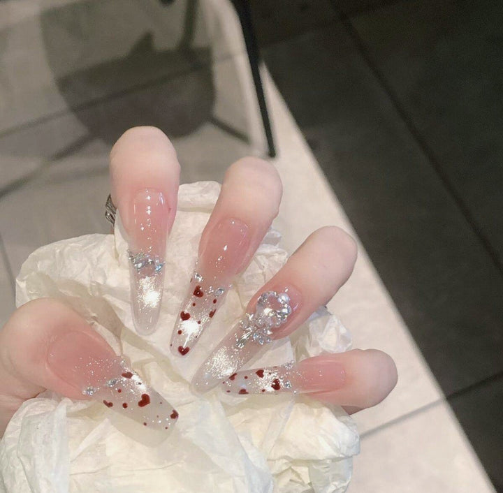 Artistic Stiletto Press-On Nail Art with Glimmering Accents Stornfield