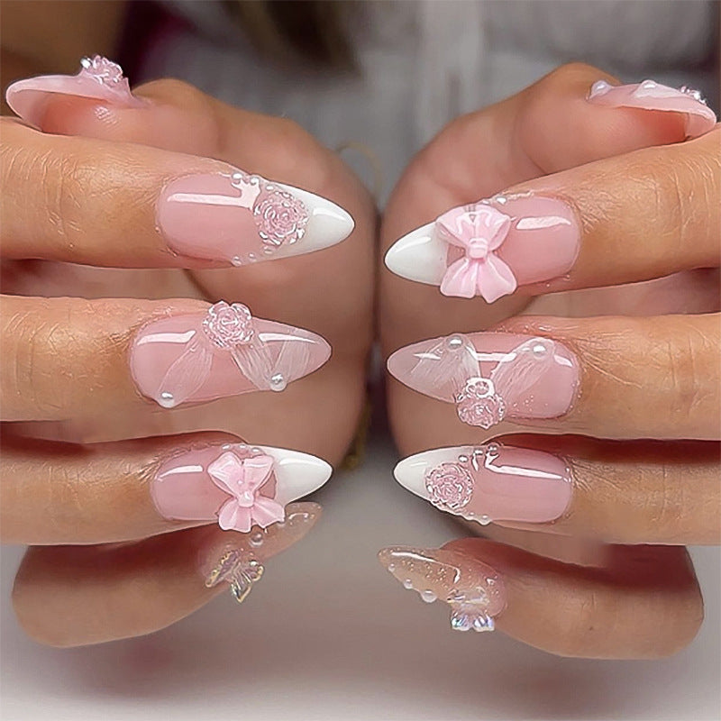 Artistic nail extensions with floral decorations and glitter accents Stornfield
