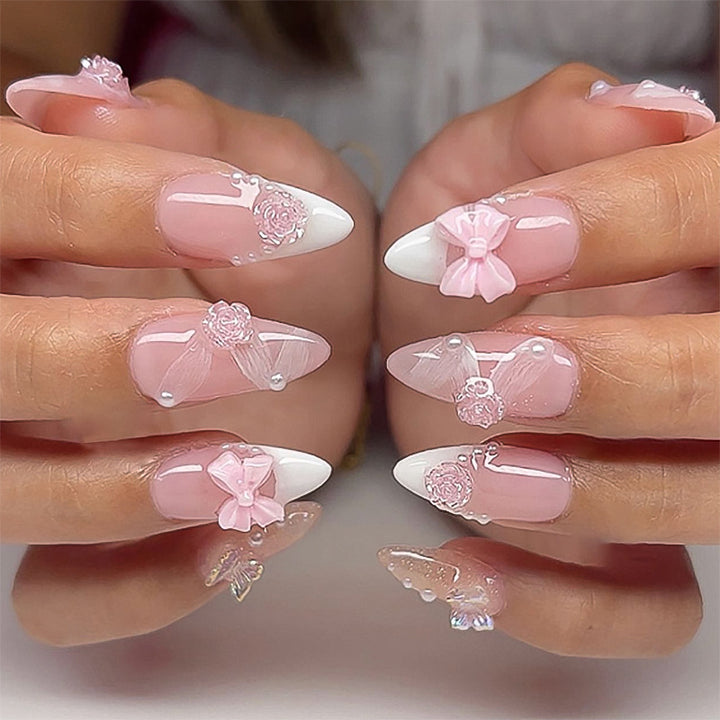 Artistic nail extensions with floral decorations and glitter accents Stornfield