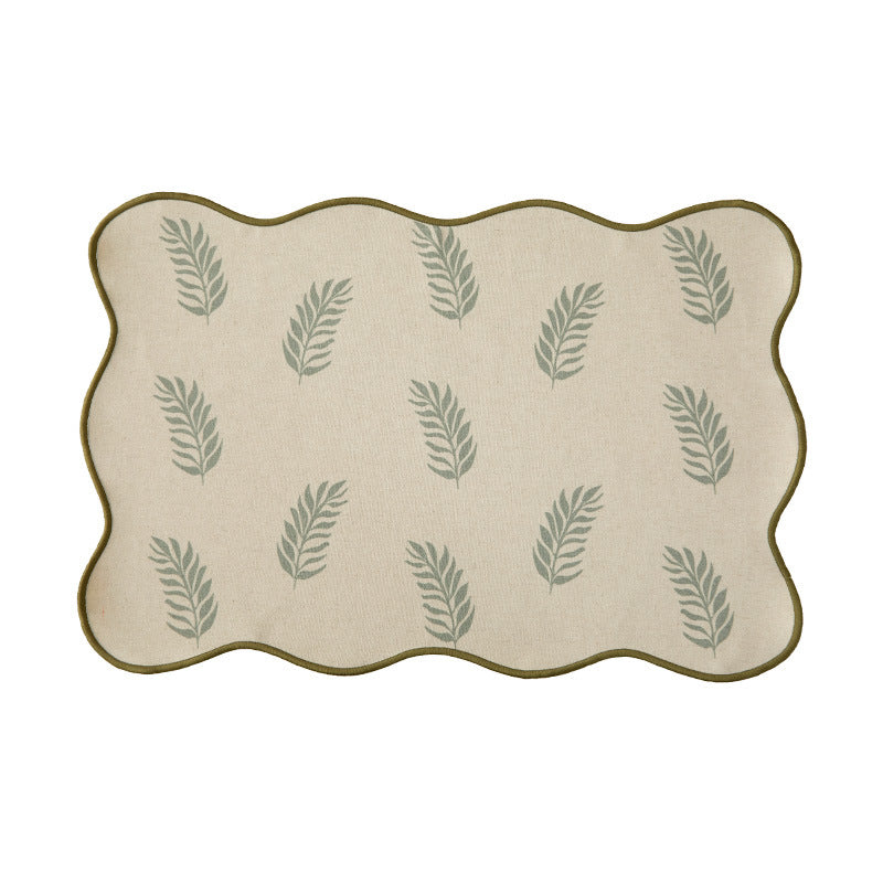 Shaped table set with curved contour and botanical leaf pattern Stornfield
