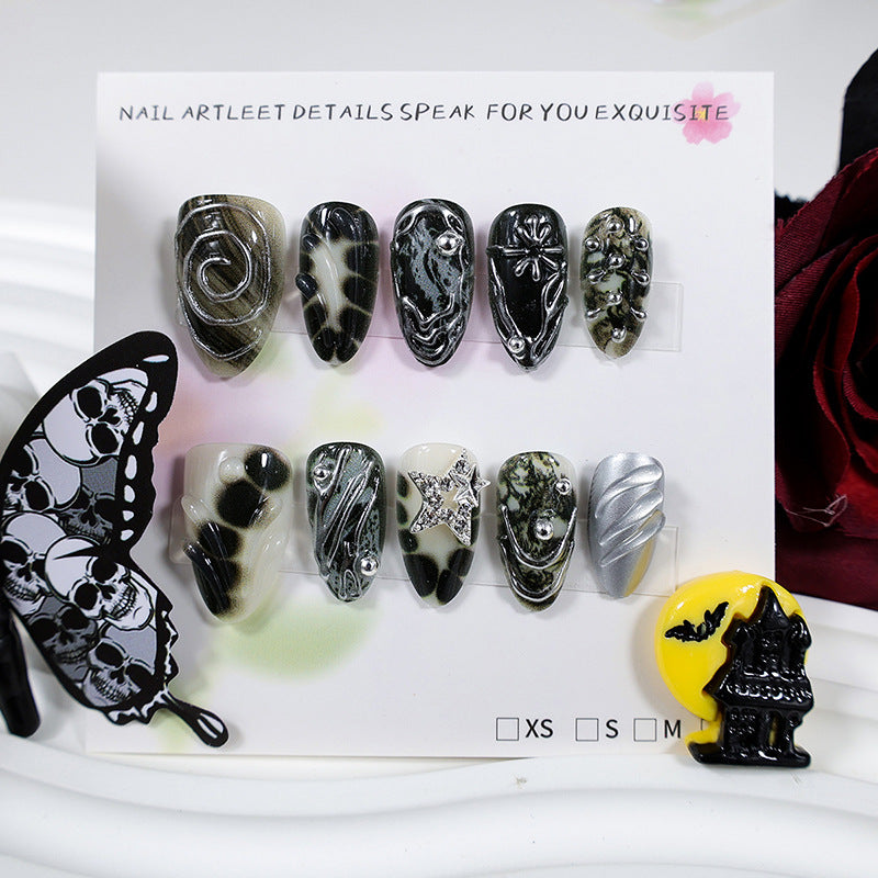 Art nail set with artistic patterns and glitter accents Stornfield