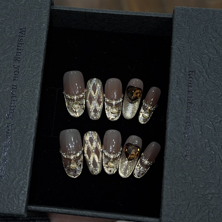 Glamorous artificial nails with glitter and heart design Stornfield