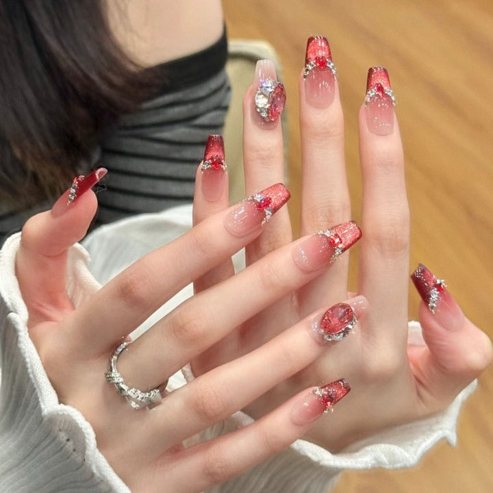 Glamorous artificial nails with sparkling rhinestone applications Stornfield