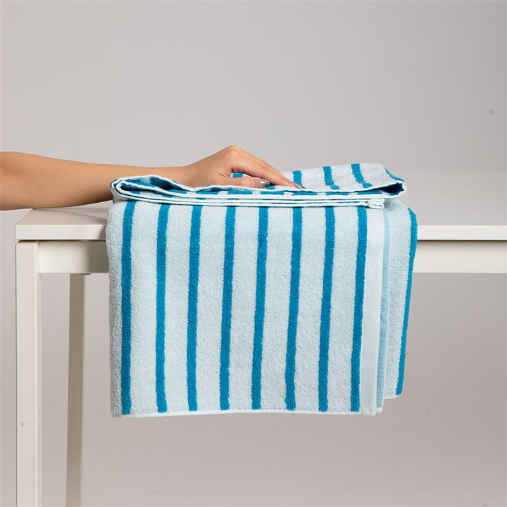 Large cotton terry towel with striped pattern and high absorbency