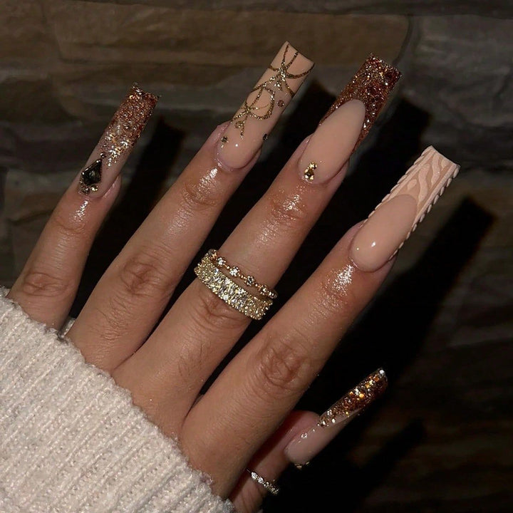 Artificial nail set with glamorous glitter and decorative elements Stornfield