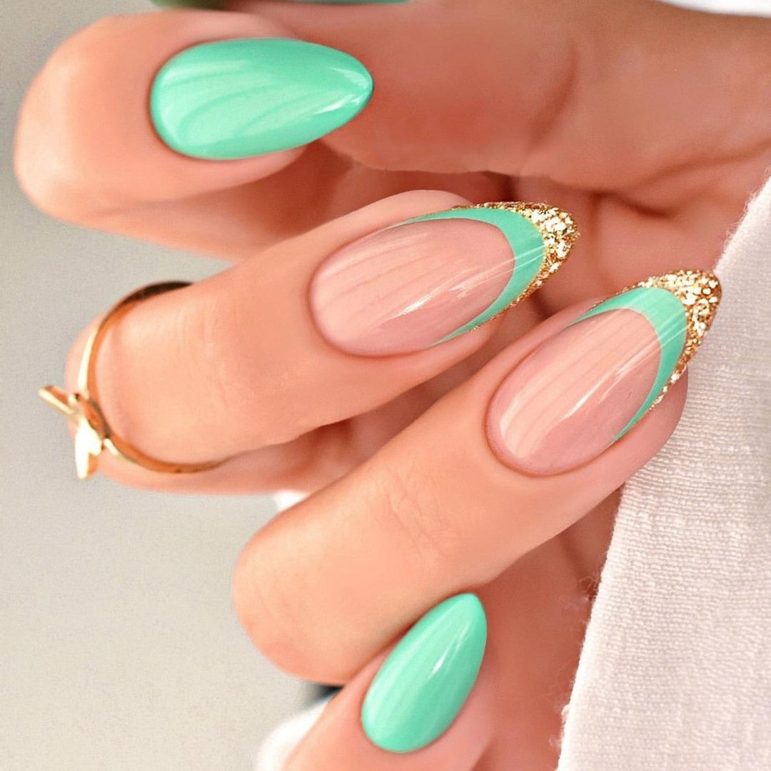 Artificial nail creation with glamorous tips and glitter details Stornfield