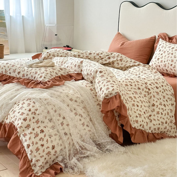 Romantic bed linen complete set made of cotton percale with delicate floral print, ruffle trim, and silky-matte finish