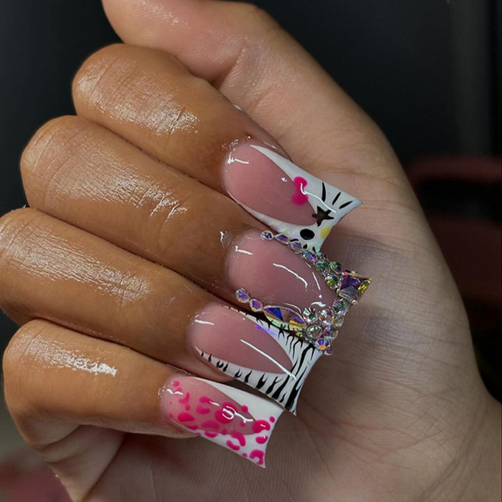 Artistic Nail Art with Animal Motif and Rhinestone Decorations Stornfield