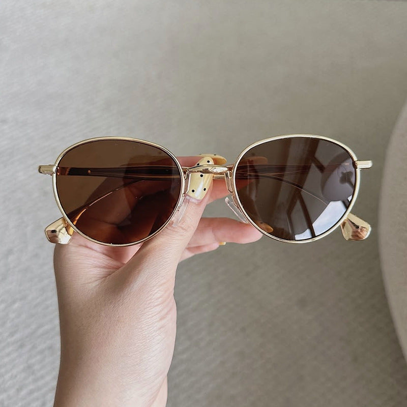 Women's round sunglasses with elegant metal frame and UV protection Stornfield