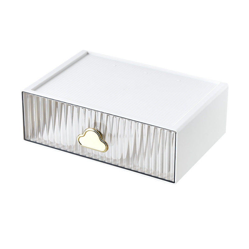 Small jewelry storage box with ribbed front and decorative cloud handle