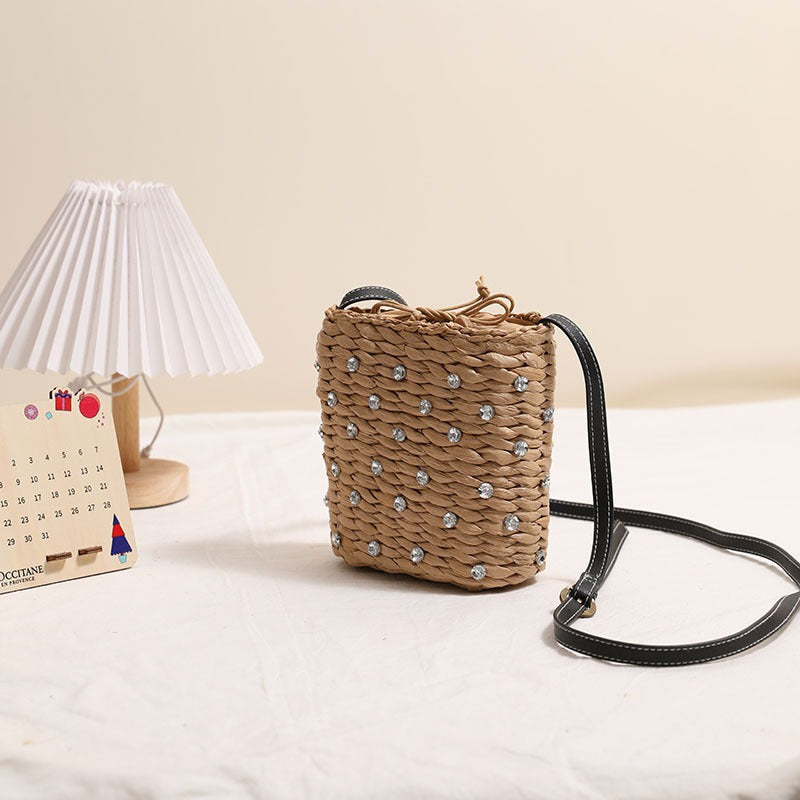Bag made of woven natural material with sparkling appliqués Stornfield