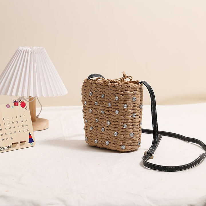 Bag made of woven natural material with sparkling appliqués Stornfield
