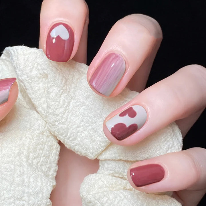 Creative nail art with heart motif and high-gloss finish Stornfield
