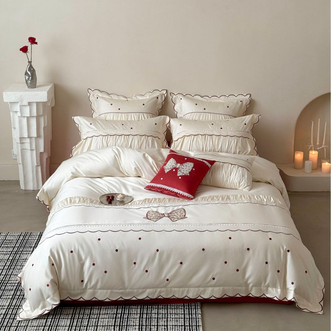 Elegant cotton satin bedding set with decorative bow appliqué and gathered frill