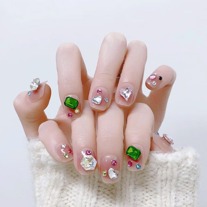 Acrylic nail set with sparkling 3D applications and beautiful heart designs Stornfield