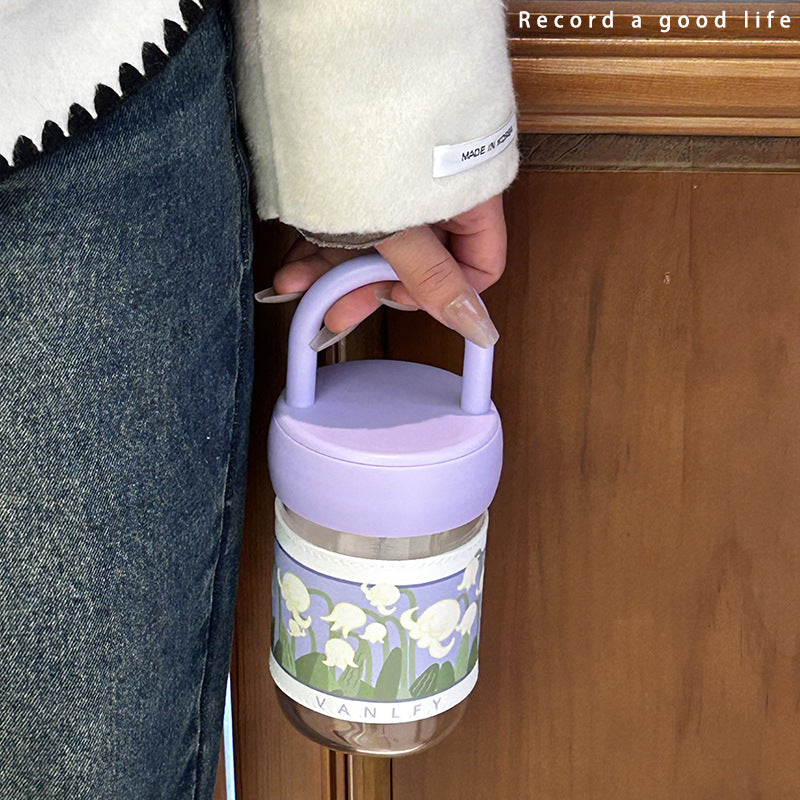 Women's insulated drinking bottle with ergonomic carrying handle and elegant flower design Stornfield