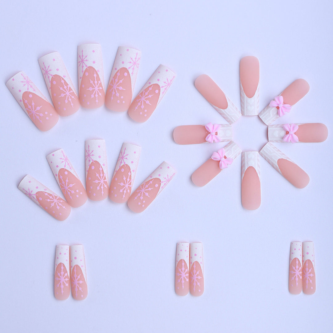 Artificial nail tips with playful bows and snowflake design Stornfield