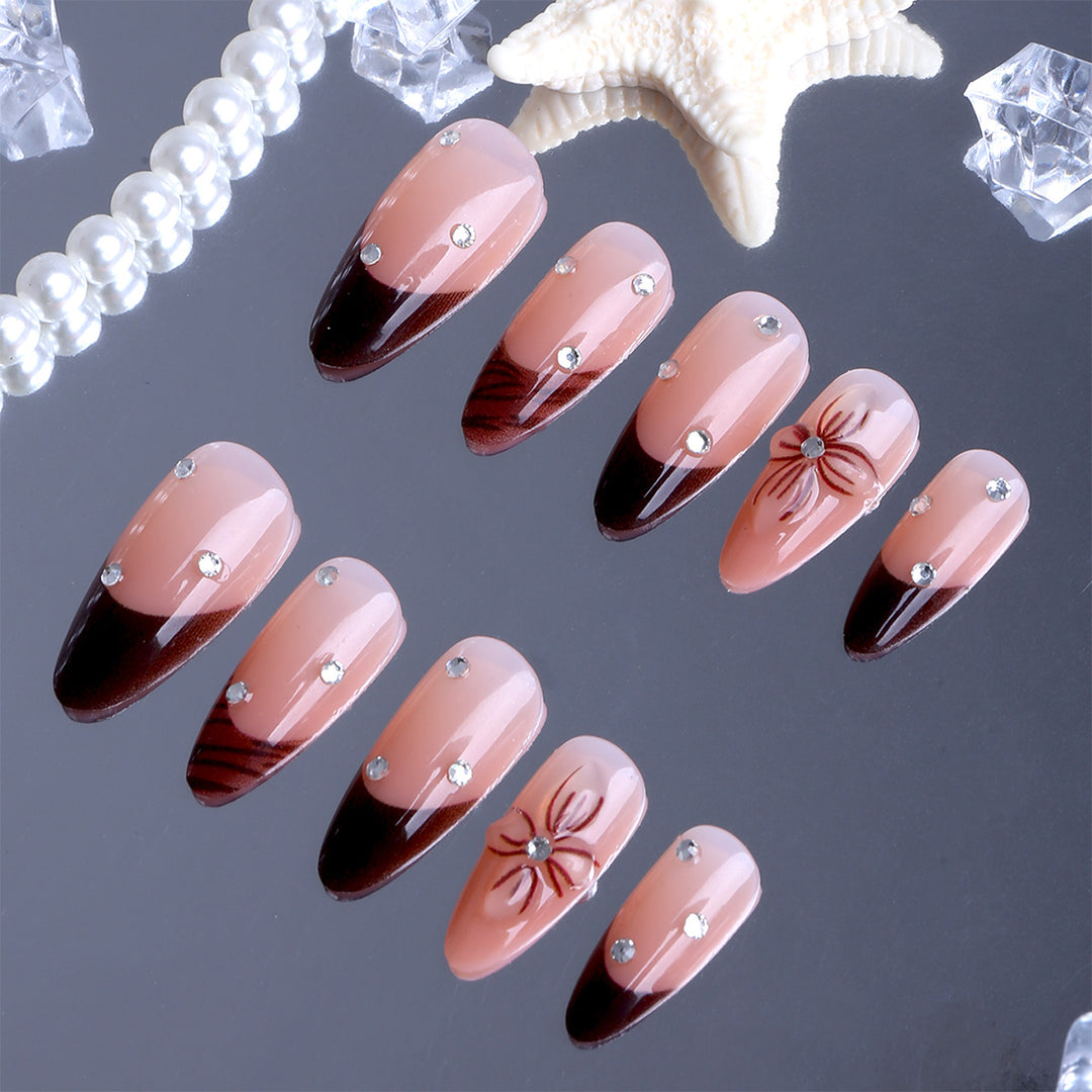 Artificial nails with elegant flower design and glitter accents Stornfield
