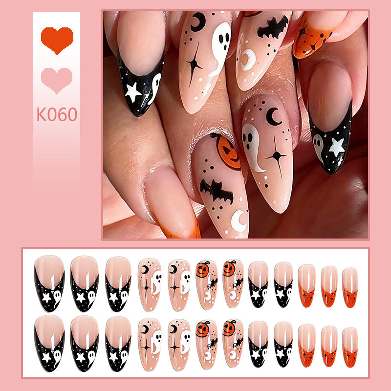 Halloween-themed artificial nails with ghost and pumpkin motifs Stornfield