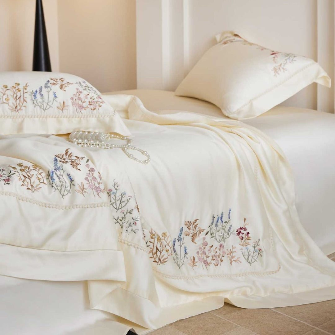 Exclusive satin bed linen set with fine floral embroidery and silky finish