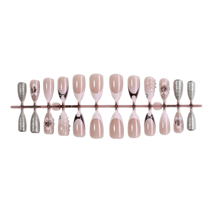 Artificial nail set with elegant flower and glitter accents Stornfield