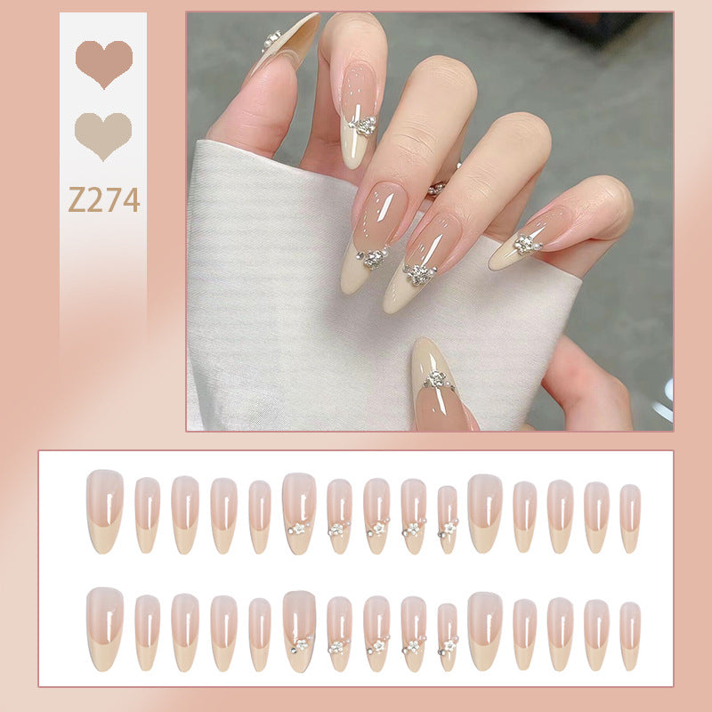 Acrylic nail set with elegant tips and sparkling appliqués Stornfield